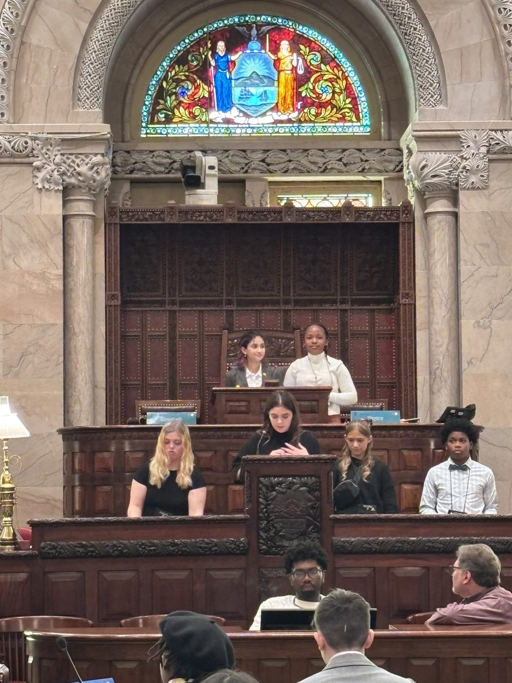 Middle school students presiding at the New York Senate rostrum