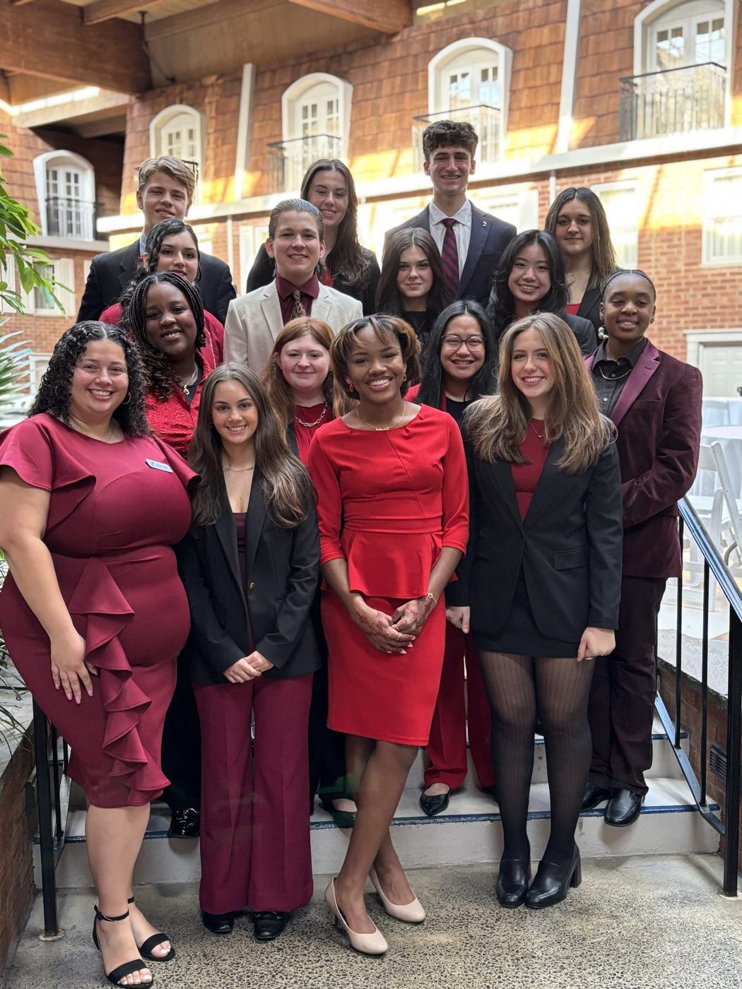 A New York delegation in business dress on a Capitol staircase